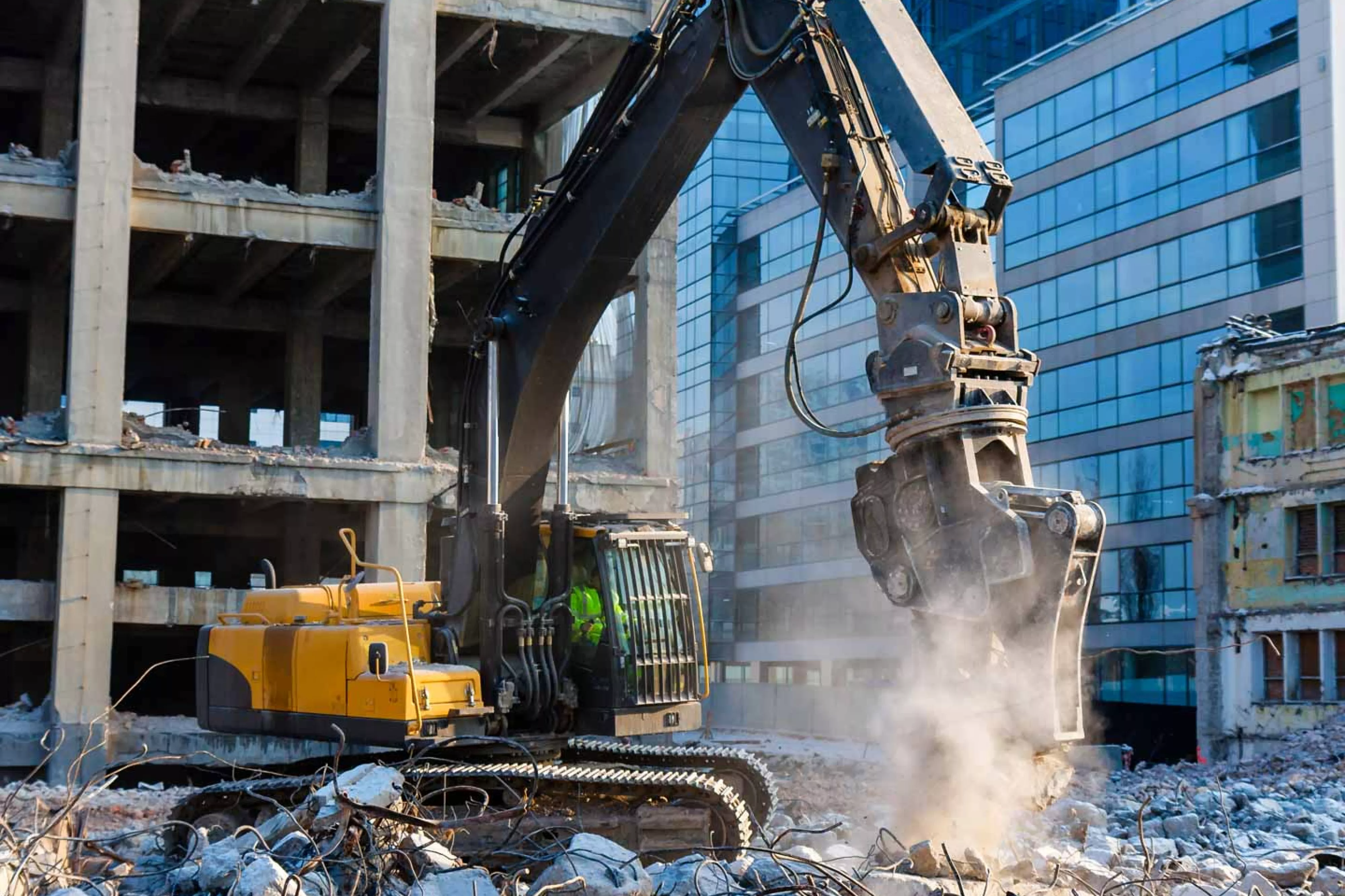 Backhoe at building demolition site