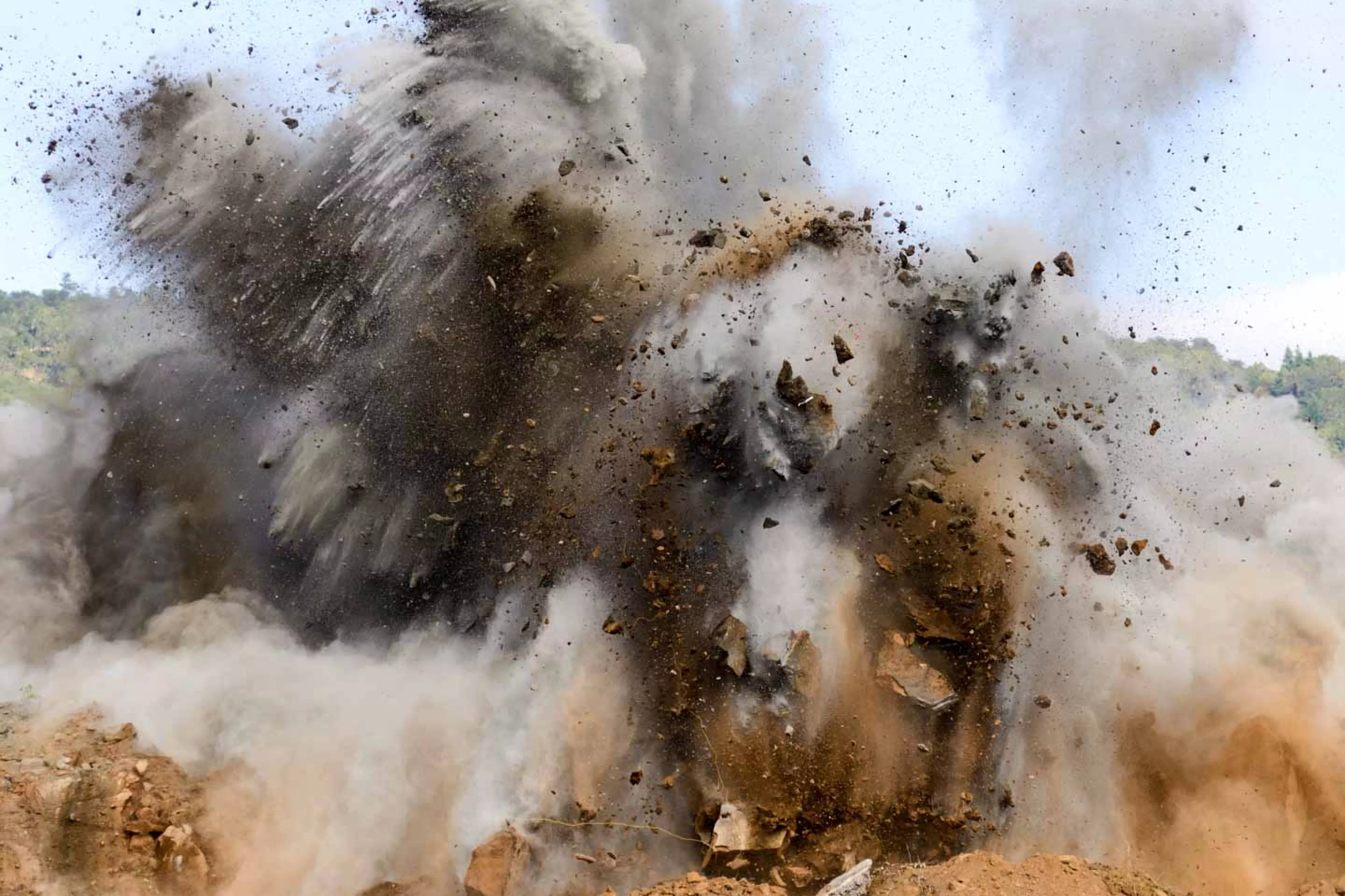 Cloud of debris from quarry blast