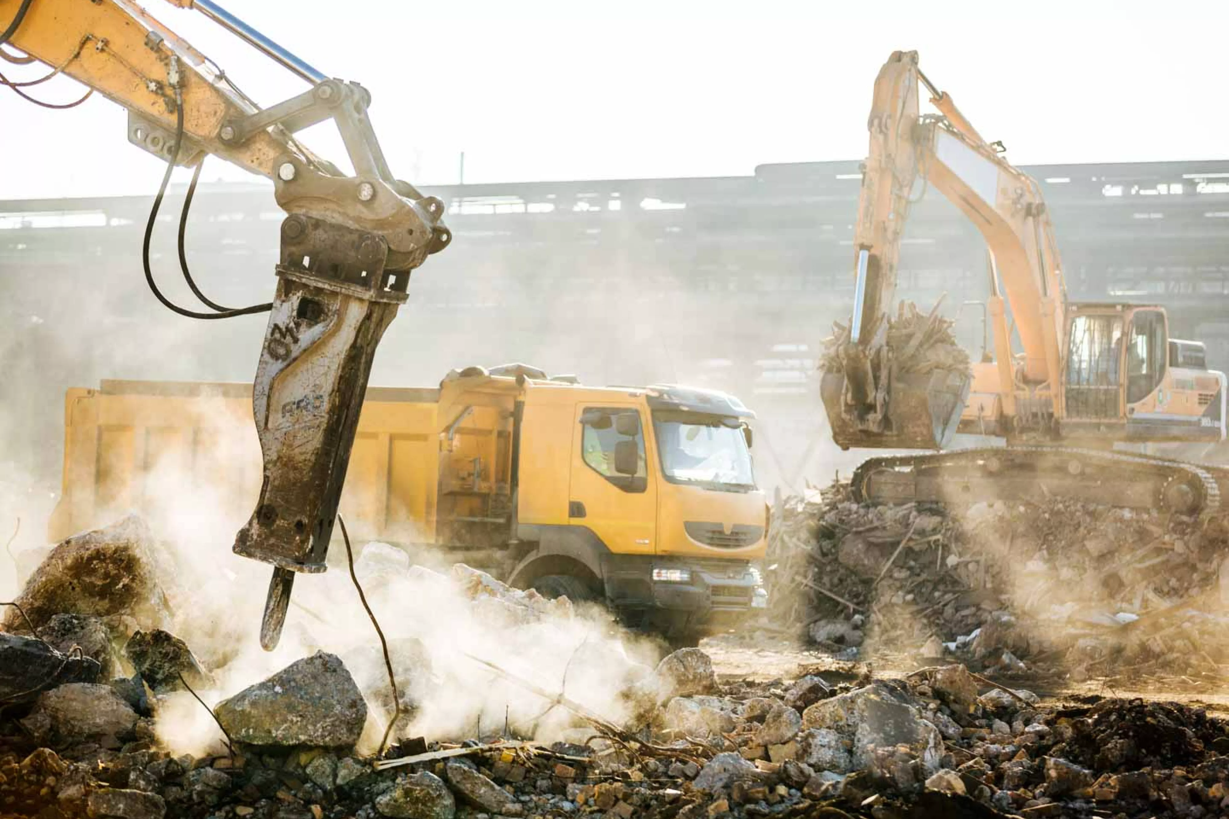 Machines move rubble at demolition site