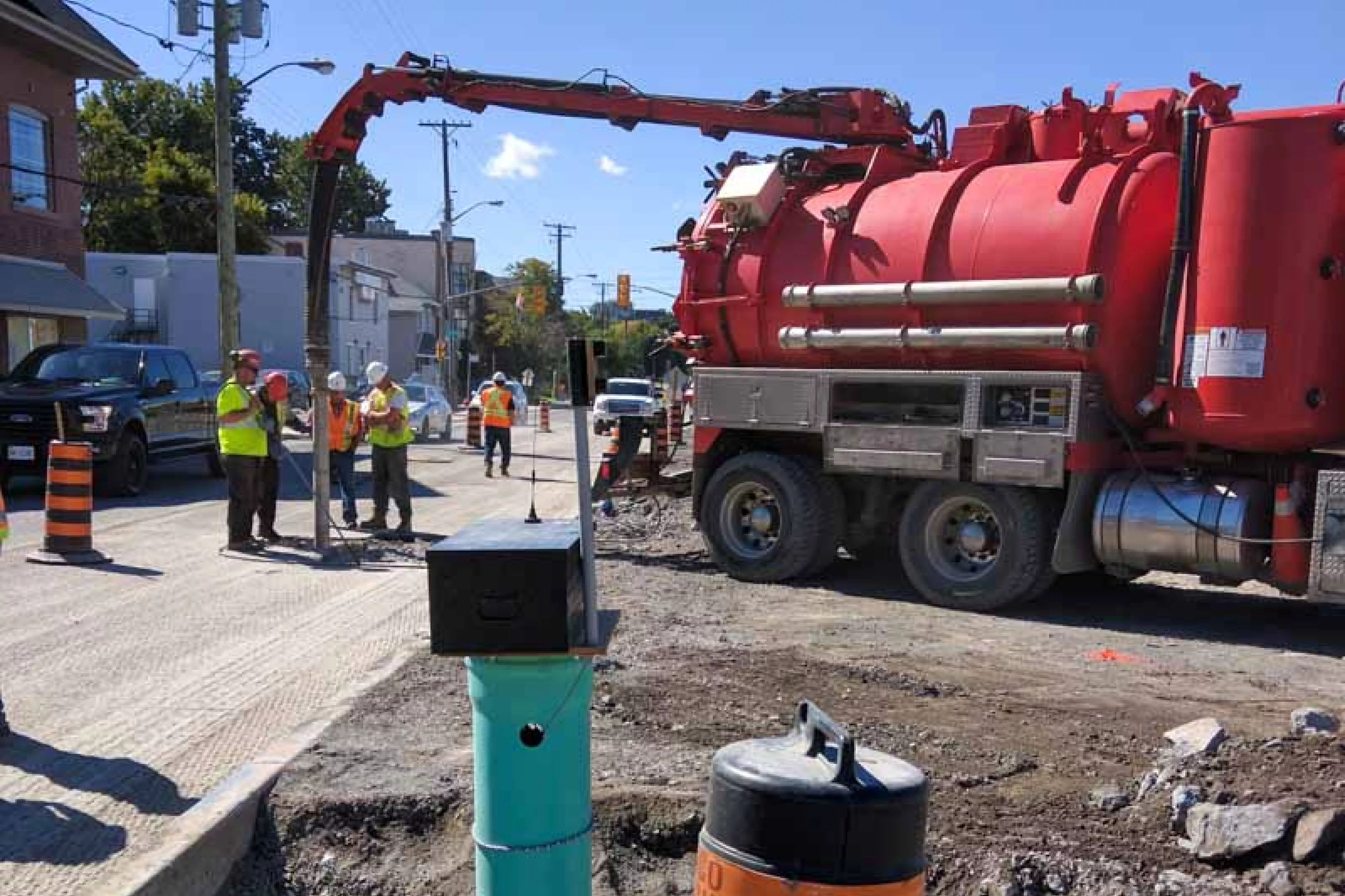 Truck drills into road for underground monitoring