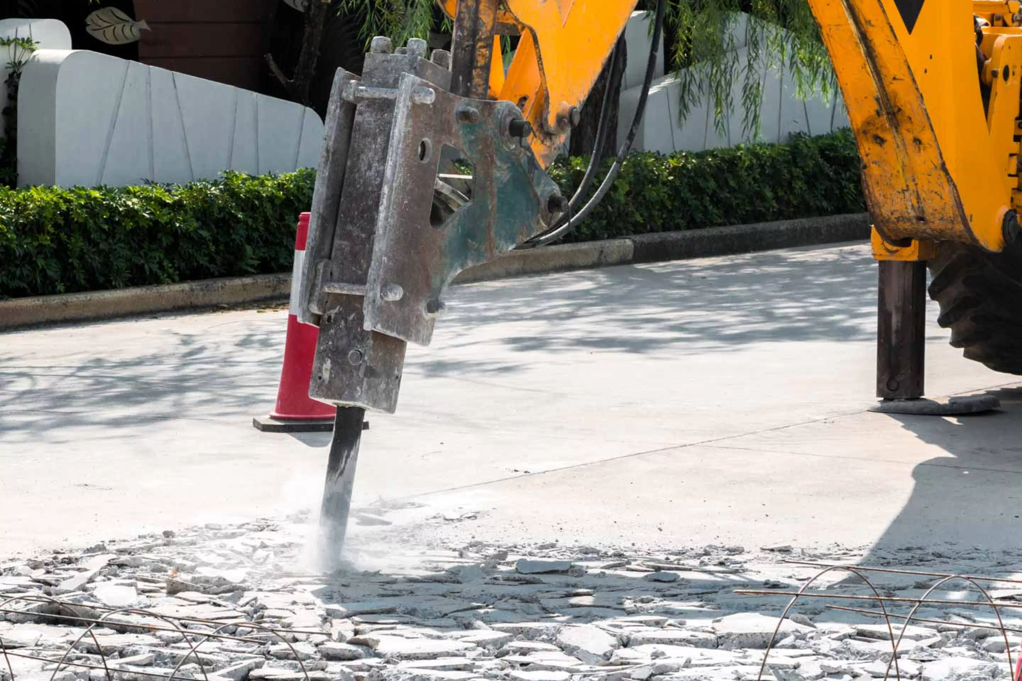 Jackhammer breaks up road asphalt