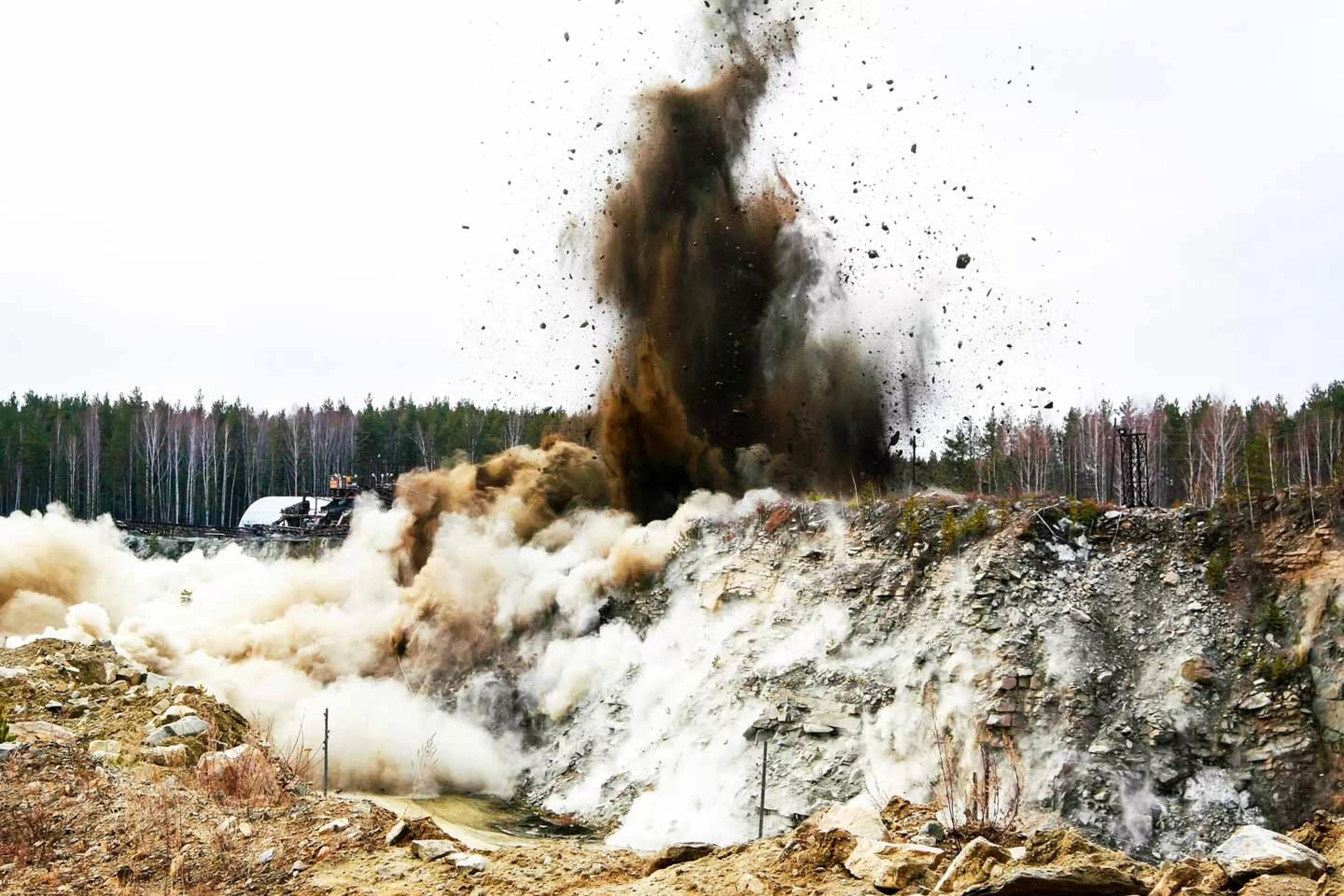 Plume of dirt rises from quarry blast