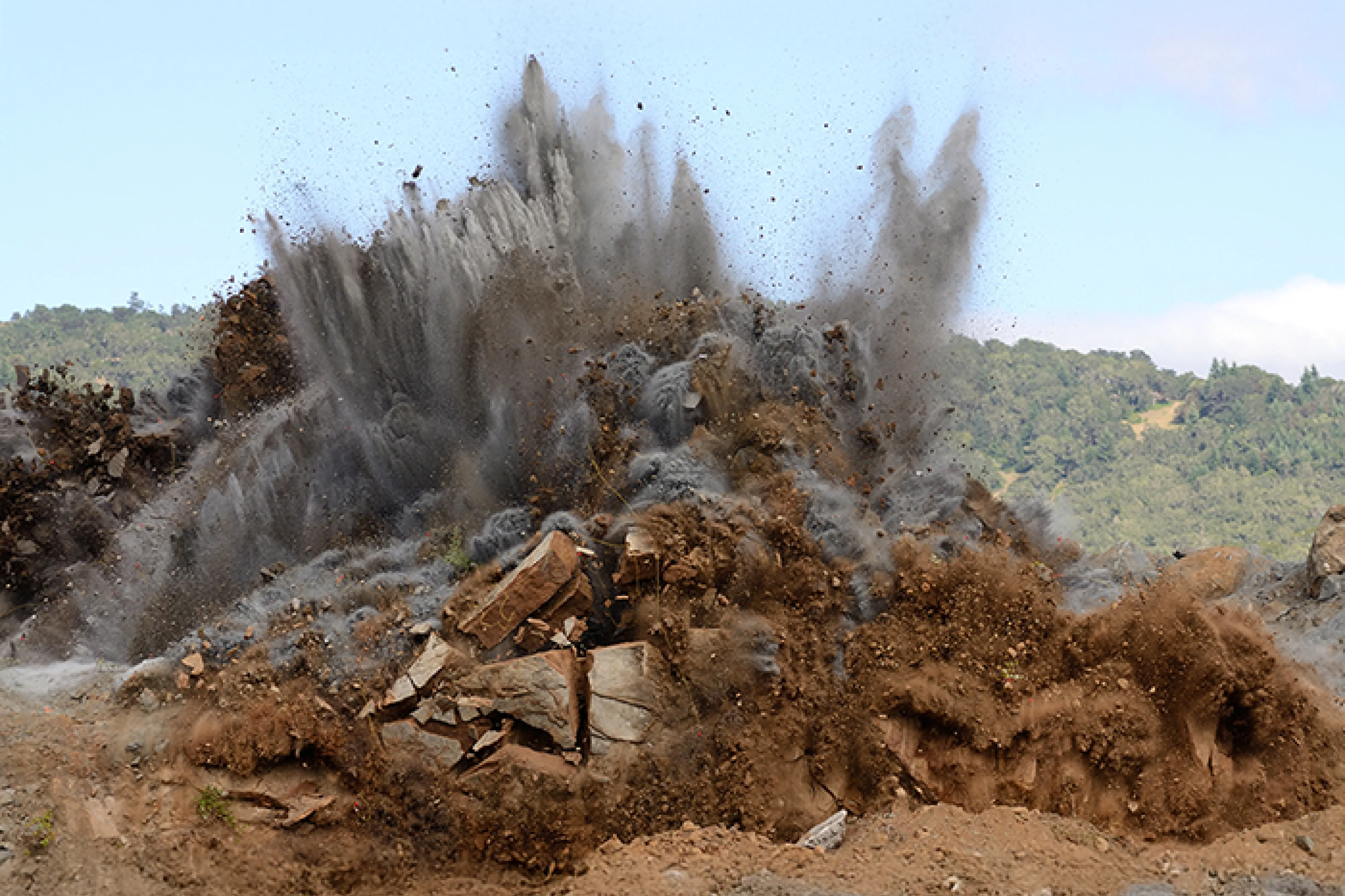 A blast shooting clouds of dirt into the air
