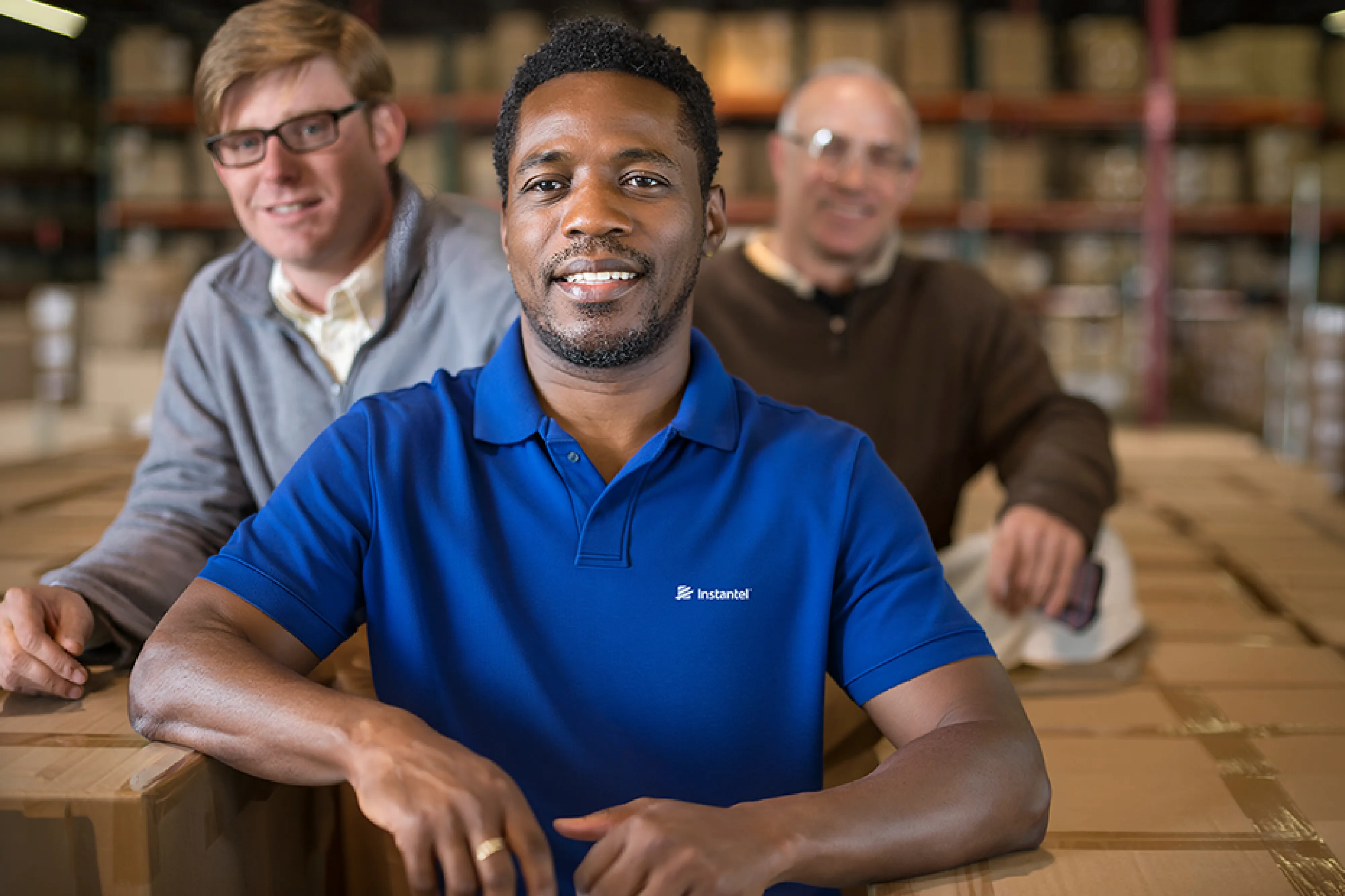 An image of Instantel employees in a warehouse