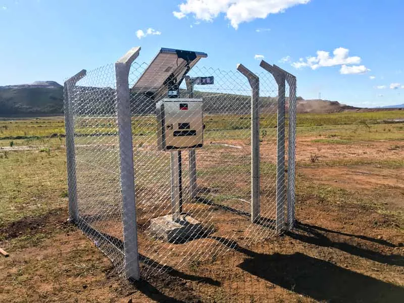 metal fence around monitoring equipment