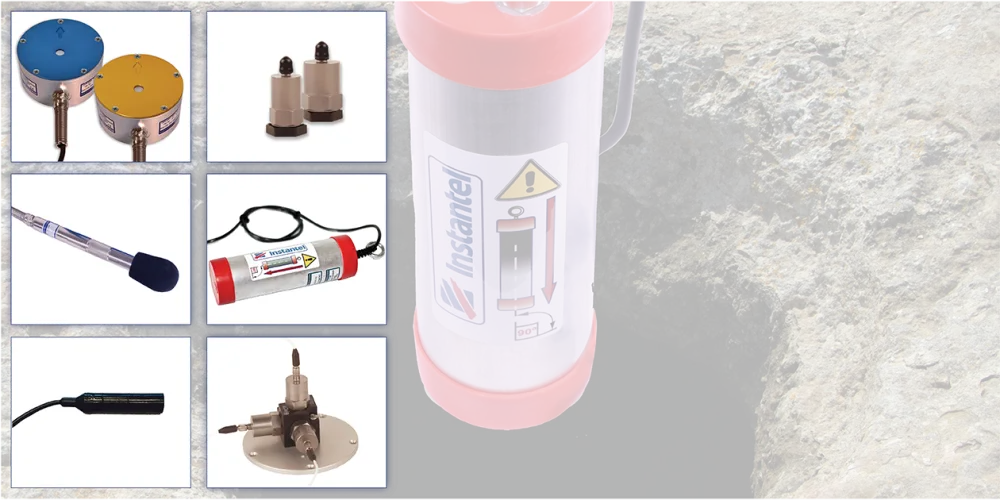 Assorted advanced Instantel sensors with a borehole geophone in the background
