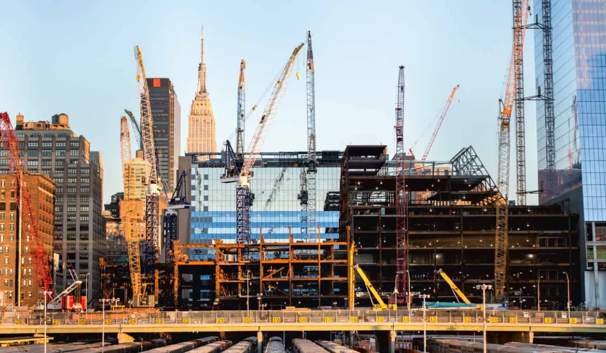 Cranes work on city construction site