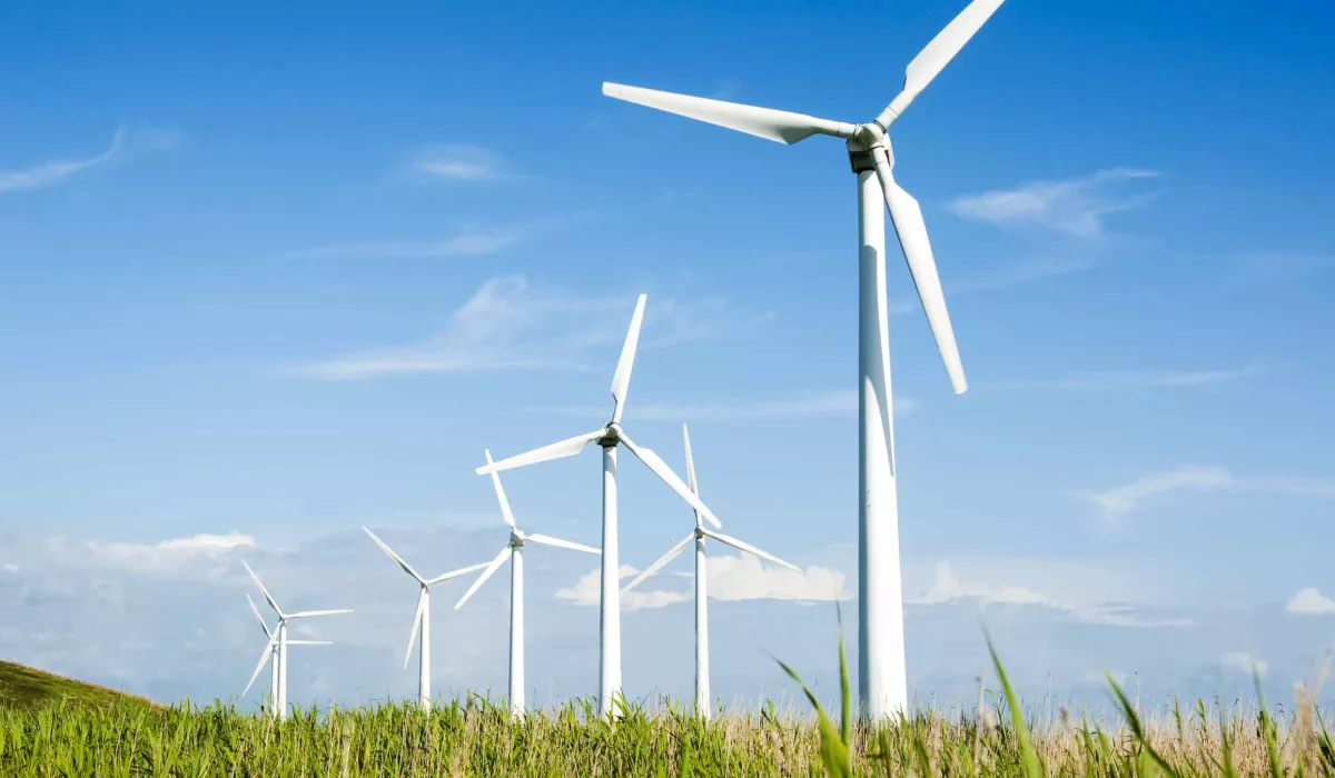 Windmills in a row in a field